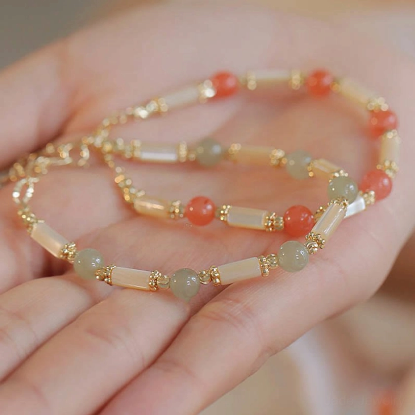 Triple blessing bracelet featuring hetian jade red agate and tridacna stone with gold spacers unisex design