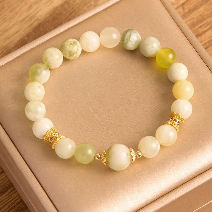 Warm-toned jade abundance bracelet with creamy yellow and white beads and gold hardware
