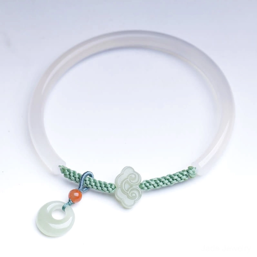 White agate Hetian jade peace buckle bracelet styled product shot showcasing overall elegance and craftsmanship