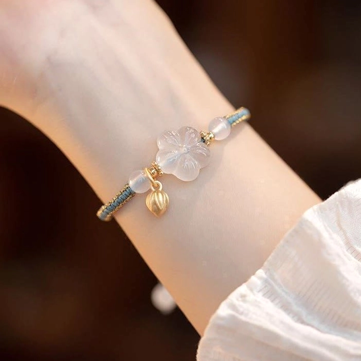 White agate lotus bracelet complete product shot with all beads and adjustable string
