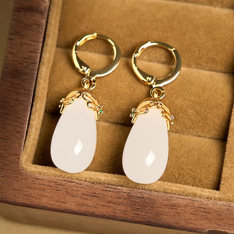 White chalcedony jade earrings pair comparison showing natural stone color consistency copper hardware durability