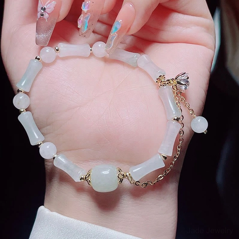 Handcrafted jade bamboo bracelet showing individual bead variation and authentic natural jade characteristics for protection and luck