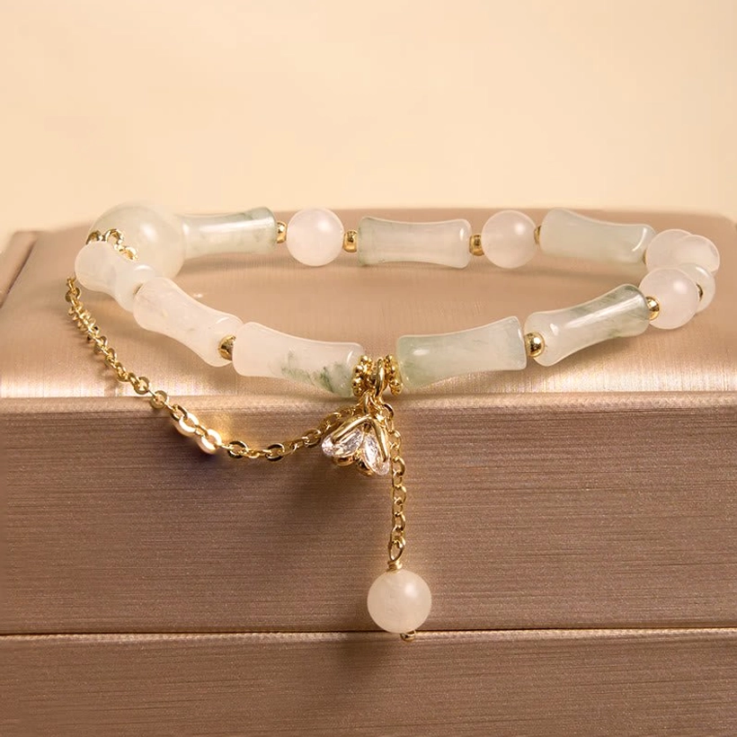 Tianshan white jade bamboo beaded bracelet in premium gold jewelry storage box, featuring gold-tone chain accents and decorative charm