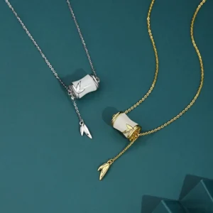 Mixed metal Hetian jade bamboo Y-lariat necklace and beaded bracelet set showcasing dual-tone sterling silver and gold chains with white jade bamboo charms and delicate leaf pendant accents