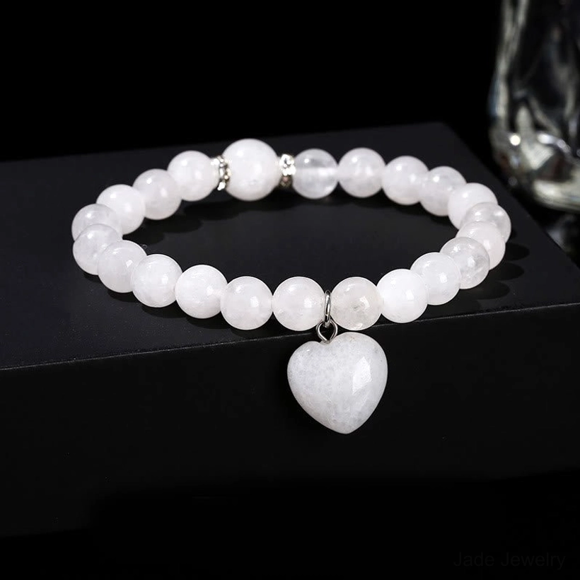 White Jade beaded heart charm bracelet showing smooth polished stone texture