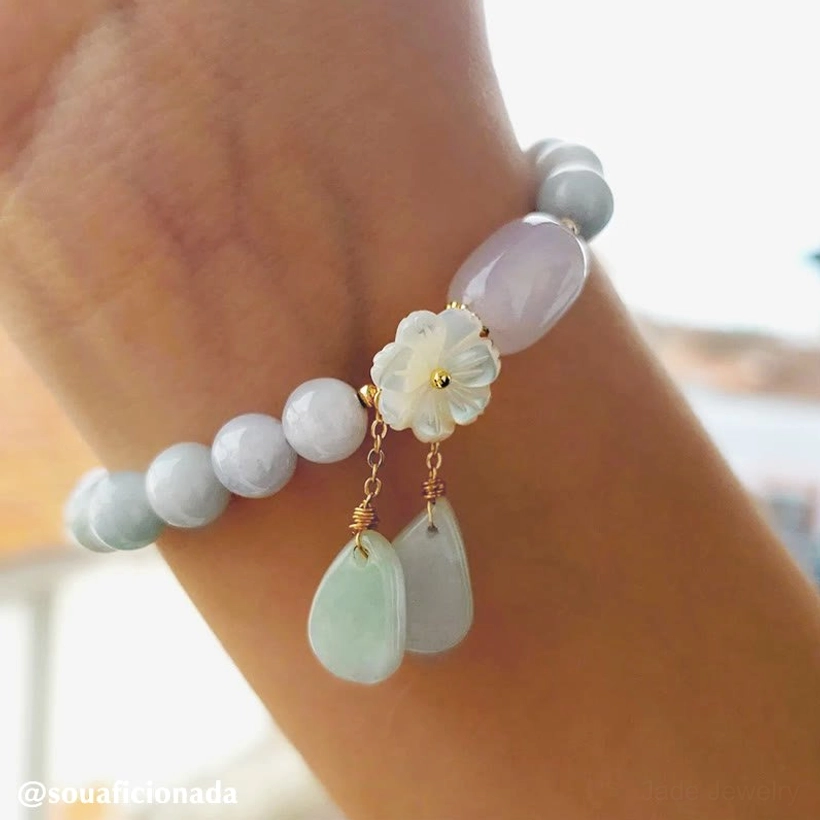White jade bracelet with shell flower ornament and teardrop charms for peace and positive energy