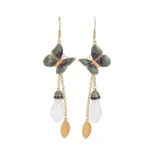 White jade butterfly dangle earrings with enamel butterfly charm and gold hardware on white background