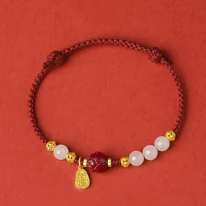 Complete braided jade lotus bracelet loop view showing knot work and gold-plated charms