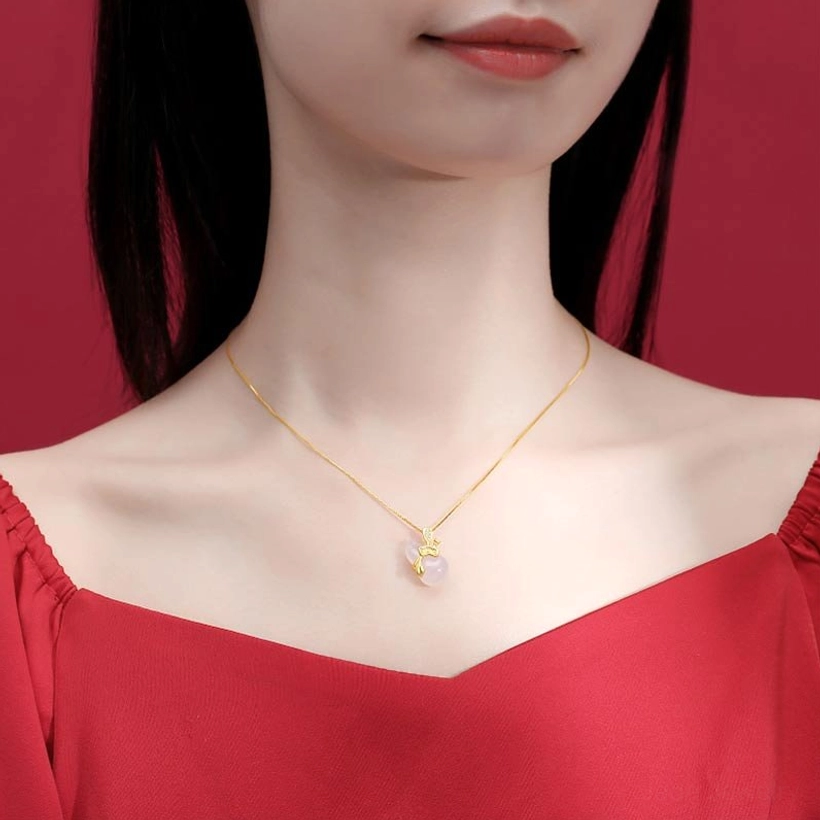 Wearable styling of white jade gourd lotus pendant necklace worn on person with red outfit in portrait setting