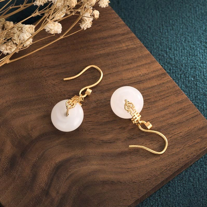 Individual white jade double happiness earring pendants showing front and back design