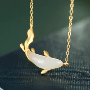 White jade koi fish pendant necklace with 925 sterling silver chain, front close-up view showing hand-carved koi detail and smooth matte white jade body on dark background