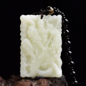 White jade Lord Guan protection pendant with intricate hand-carved Guangong figure and dragon motif, displayed on natural wooden base with black beaded mantra chain