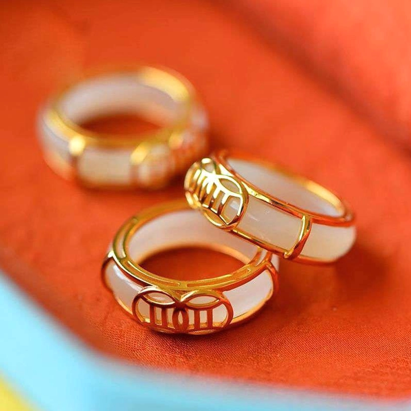 White jade lucky ring necklace set with gold-plated copper wire, featuring hollowed lucky coin motifs and dual-tone design, flat lay display