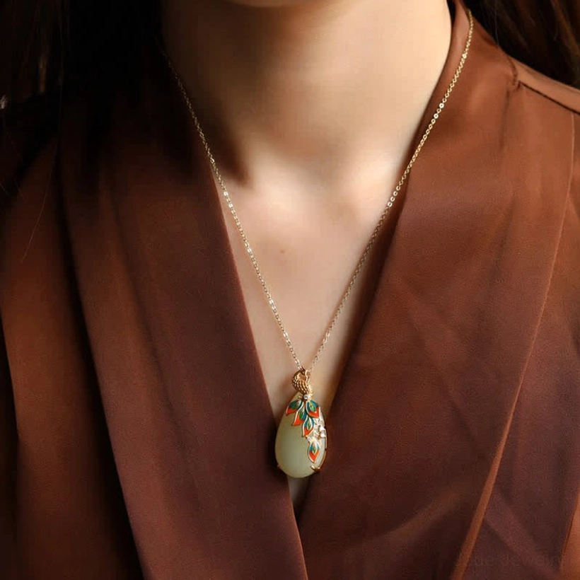White jade peacock pendant necklace worn on neck, gold chain with colorful enamel peacock design, daily styling showcase