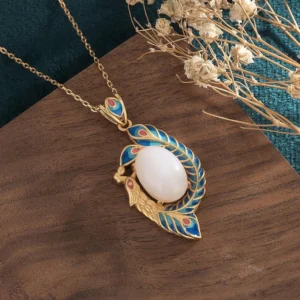 Handmade white jade peacock pendant side view showing cloisonne enamel work and gold chain attachment