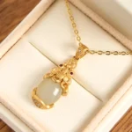 White jade Pixiu gold necklace pendant in elegant gift box presentation - wealth protection talisman
