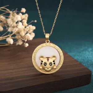 White jade tiger blessing necklace front view - golden tiger charm with engraved frame on white jade disc