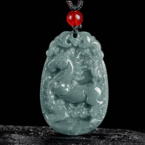 Year of the Horse carved jade pendant necklace with red bead and black cord - front view showing detailed animal carving